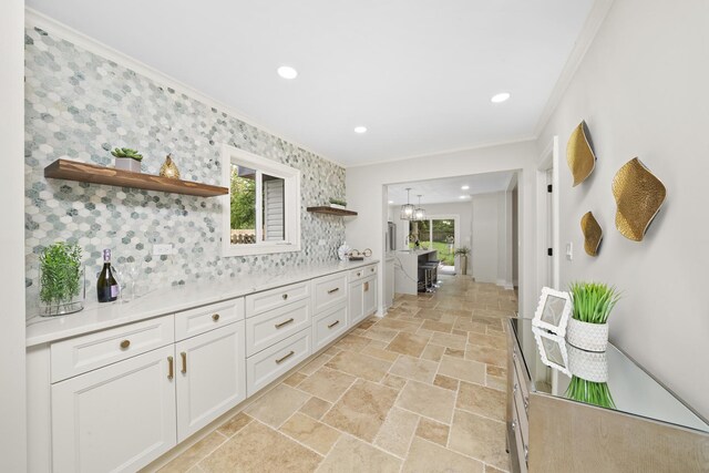 504 Newton Ave, Glen Ellyn, IL 60137 - kitchen featuring ornamental molding, open shelves, stone tile floors, light countertops, and white cabinets
