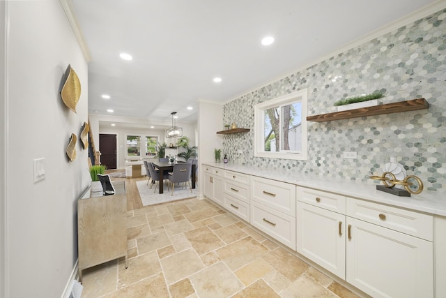 504 Newton Ave, Glen Ellyn, IL 60137 - kitchen with open shelves, crown molding, backsplash, white cabinets, and light countertops