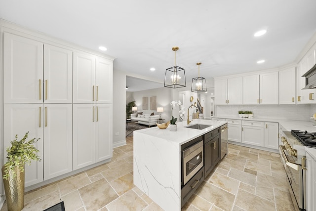 504 Newton Ave, Glen Ellyn, IL 60137 - kitchen featuring stainless steel appliances, a sink, stone tile flooring, recessed lighting, and white cabinetry