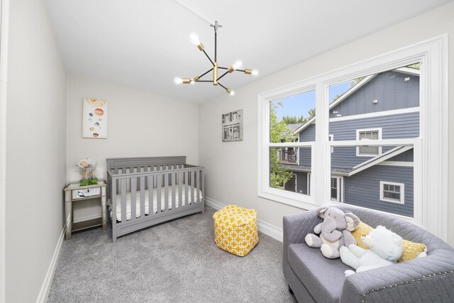 504 Newton Ave, Glen Ellyn, IL 60137 - carpeted bedroom with a chandelier and baseboards