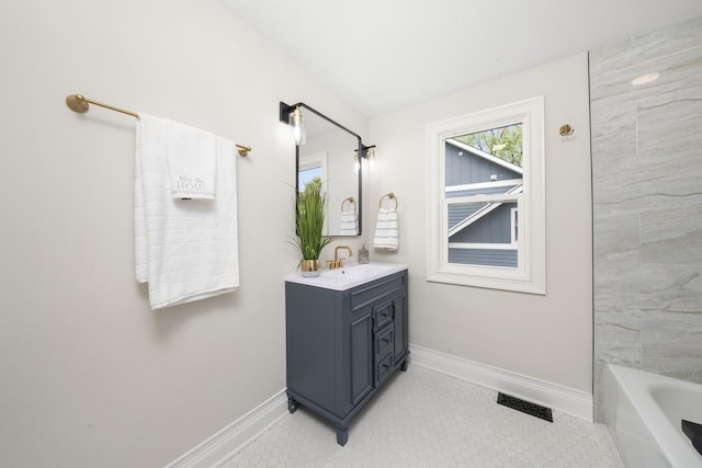 504 Newton Ave, Glen Ellyn, IL 60137 - bathroom featuring vanity, baseboards, and a bath