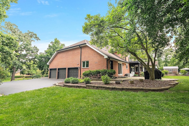 10 Black Walnut Trl, Palos Park, IL 60464 - view of property exterior with brick siding, a lawn, driveway, and a garage