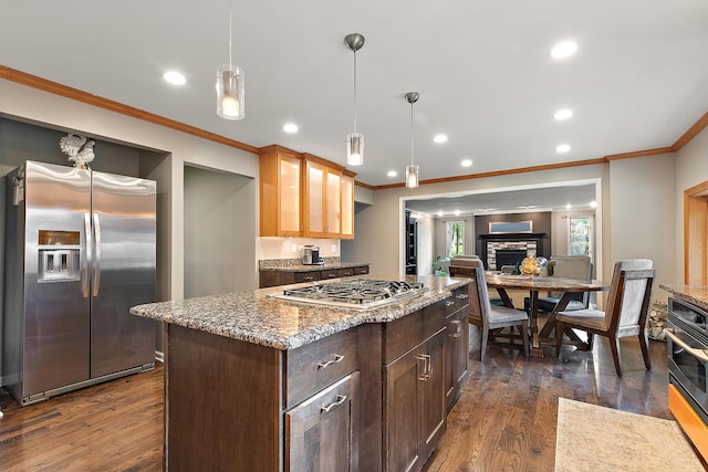 10 Black Walnut Trl, Palos Park, IL 60464 - kitchen featuring stainless steel appliances, ornamental molding, dark wood finished floors, recessed lighting, and light stone counters