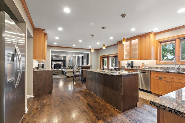 10 Black Walnut Trl, Palos Park, IL 60464 - kitchen with appliances with stainless steel finishes, ornamental molding, open floor plan, a kitchen island, and plenty of natural light