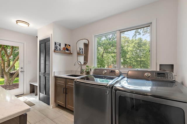 10 Black Walnut Trl, Palos Park, IL 60464 - laundry area featuring cabinet space, washing machine and clothes dryer, and light tile patterned floors