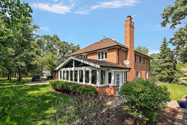 10 Black Walnut Trl, Palos Park, IL 60464 - rear view of property featuring brick siding, a chimney, a sunroom, and a yard