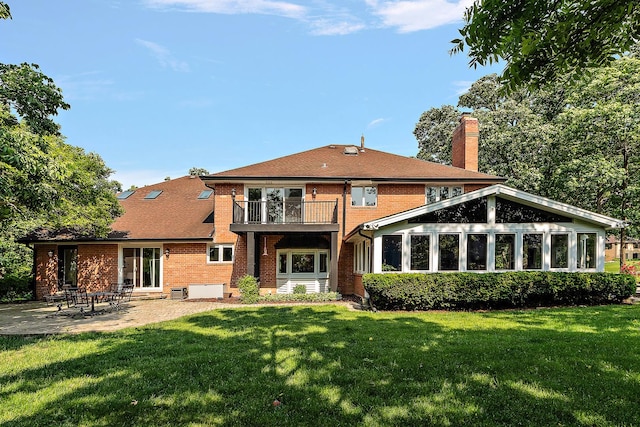 10 Black Walnut Trl, Palos Park, IL 60464 - rear view of property featuring a balcony, a chimney, brick siding, a patio, and a yard
