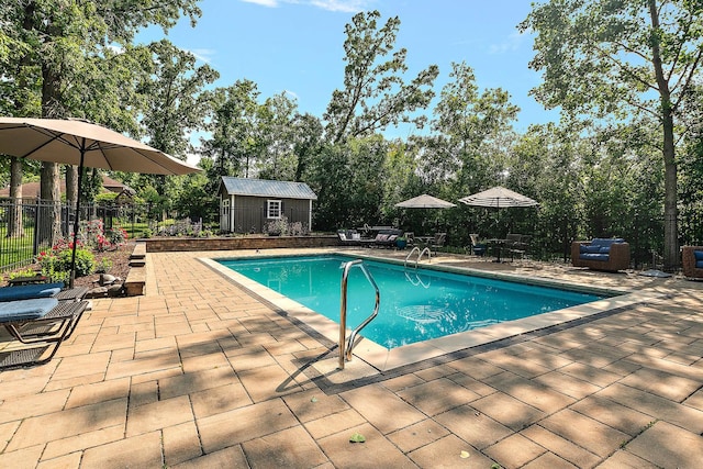 10 Black Walnut Trl, Palos Park, IL 60464 - view of swimming pool with a patio area, a fenced backyard, a storage shed, and view of wooded area
