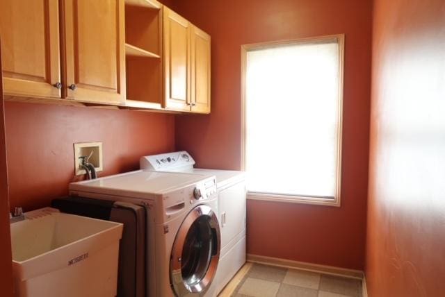 957 Chancery Ln, Cary, IL 60013 - laundry room featuring separate washer and dryer, cabinet space, baseboards, and light floors
