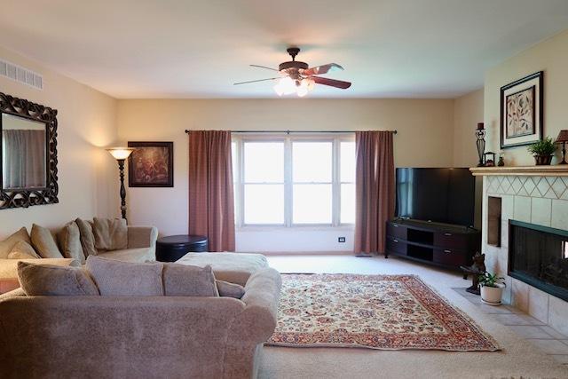957 Chancery Ln, Cary, IL 60013 - living room featuring ceiling fan and a fireplace