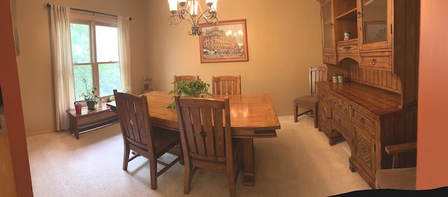 957 Chancery Ln, Cary, IL 60013 - dining area featuring light colored carpet, a chandelier, and baseboards