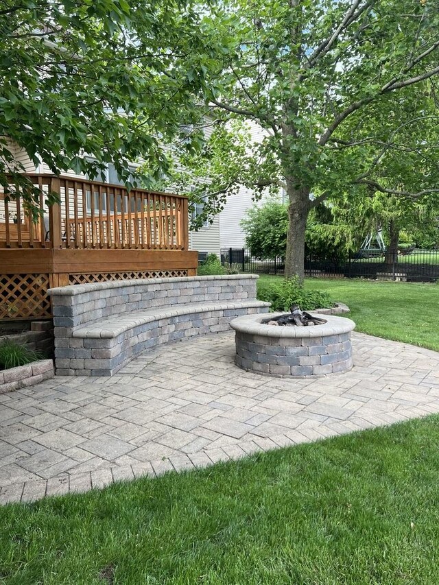 957 Chancery Ln, Cary, IL 60013 - view of patio featuring a fire pit and a deck