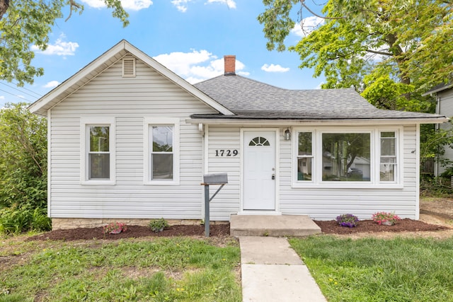 1729 S Hamilton St, Lockport, IL 60441 - bungalow-style home featuring a shingled roof, a chimney, and a front yard