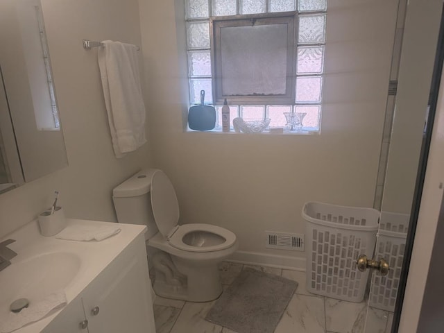 8918 S Euclid Ave, Chicago, IL 60617 - bathroom featuring plenty of natural light, vanity, and marble look tiles