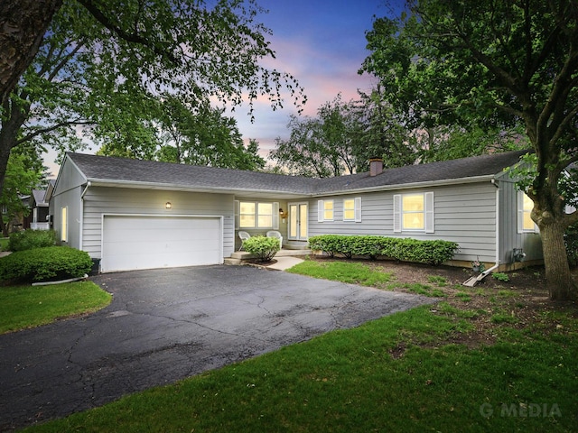 1720 Brookhill Ln, Sycamore, IL 60178 - single story home featuring asphalt driveway, an attached garage, and a chimney