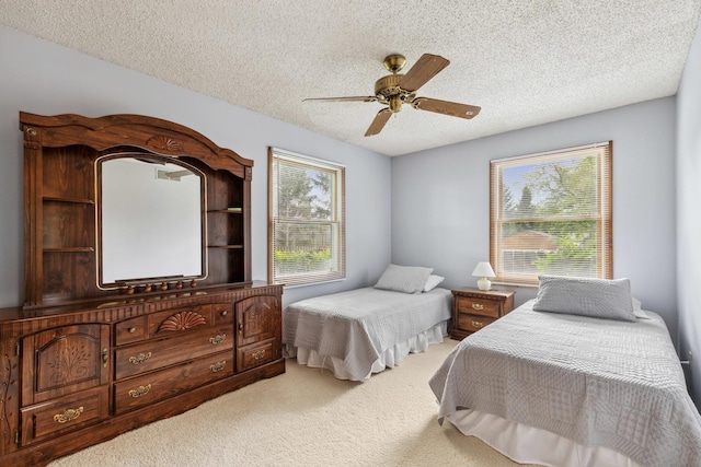 1720 Brookhill Ln, Sycamore, IL 60178 - carpeted bedroom featuring a textured ceiling and a ceiling fan