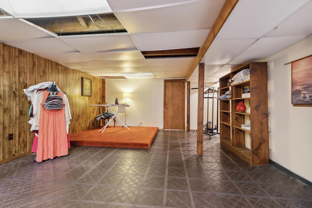 1720 Brookhill Ln, Sycamore, IL 60178 - finished basement featuring wood walls, tile patterned floors, a drop ceiling, and baseboards