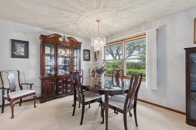 1720 Brookhill Ln, Sycamore, IL 60178 - dining room with light carpet, a chandelier, a textured ceiling, and baseboards