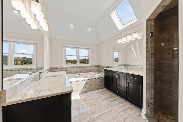 4328 Chinaberry Ln, Naperville, IL 60564 - bathroom featuring a skylight, vanity, lofted ceiling, a garden tub, and a shower stall