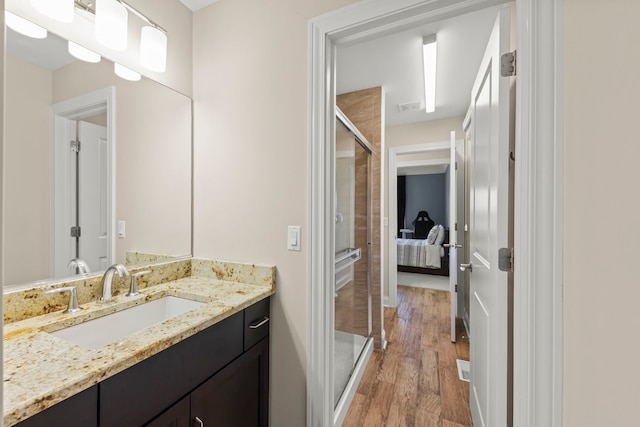 4328 Chinaberry Ln, Naperville, IL 60564 - bathroom with vanity, wood finished floors, a shower stall, and ensuite bathroom