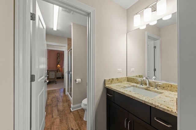 4328 Chinaberry Ln, Naperville, IL 60564 - full bathroom with vanity, wood finished floors, toilet, and a stall shower