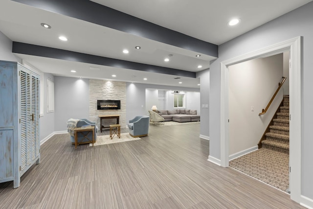 4328 Chinaberry Ln, Naperville, IL 60564 - living room with a stone fireplace, stairway, baseboards, light wood-style flooring, and recessed lighting