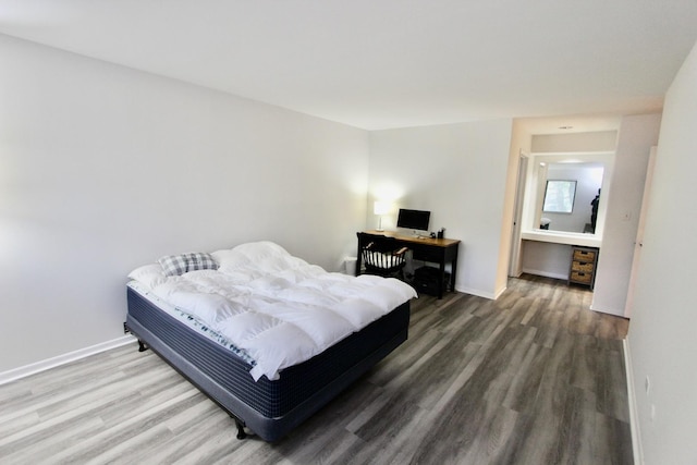10 Old Oak Dr Unit 103, Buffalo Grove, IL 60089 - bedroom with wood finished floors, an office area, and baseboards