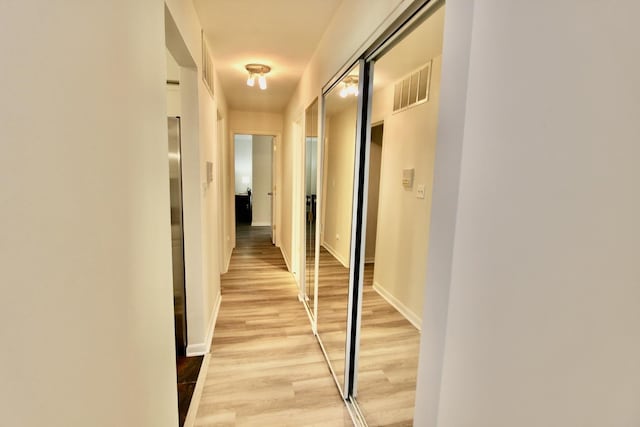 10 Old Oak Dr Unit 103, Buffalo Grove, IL 60089 - corridor with light wood finished floors and baseboards