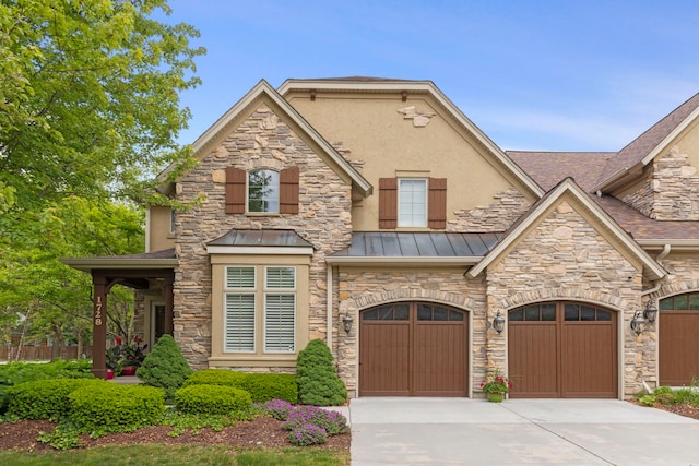 1728 Elyse Ln, Naperville, IL 60565 - view of front of house with concrete driveway, a standing seam roof, stone siding, stucco siding, and an attached garage