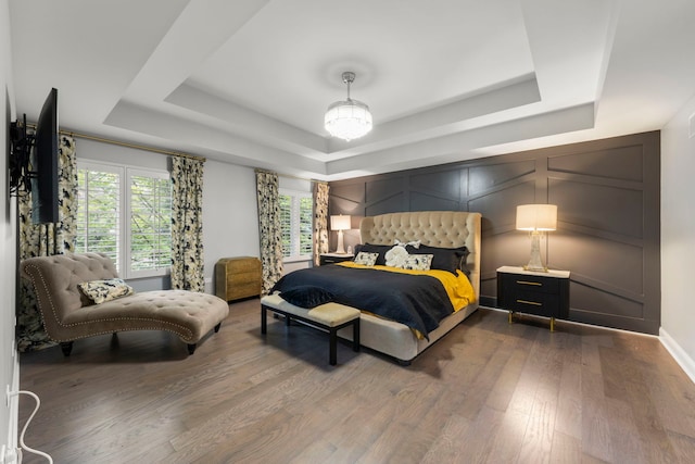 1728 Elyse Ln, Naperville, IL 60565 - bedroom featuring a tray ceiling, dark wood-type flooring, and a decorative wall