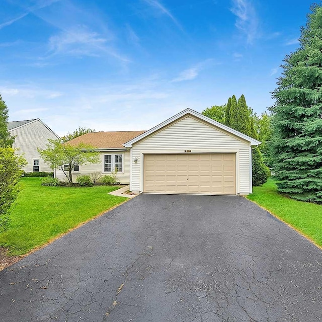 1499 Raven Dr, Bolingbrook, IL 60490 - ranch-style home with driveway, a front yard, and a garage