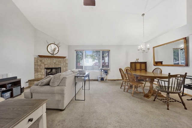 1499 Raven Dr, Bolingbrook, IL 60490 - living area featuring a chandelier, light colored carpet, a stone fireplace, lofted ceiling, and baseboards