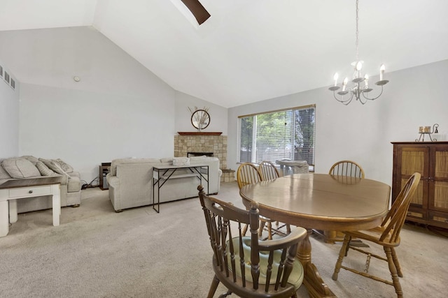 1499 Raven Dr, Bolingbrook, IL 60490 - dining area with light carpet, lofted ceiling, a fireplace, and a chandelier