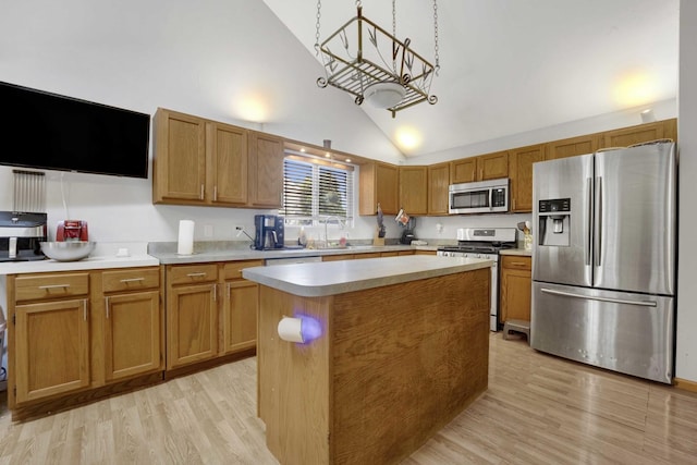1499 Raven Dr, Bolingbrook, IL 60490 - kitchen with stainless steel appliances, light wood-style floors, light countertops, a chandelier, and brown cabinets