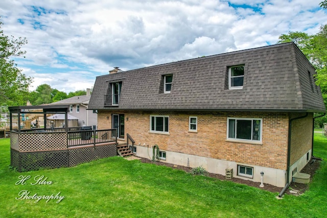 1402 Winaki Trl, Algonquin, IL 60102 - back of house with a shingled roof, a lawn, brick siding, a deck, and mansard roof