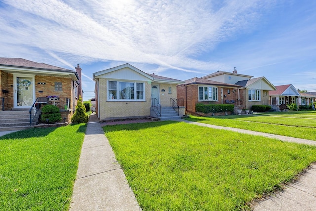 7817 Menard Ave, Burbank, IL 60459 - bungalow with brick siding and a front yard
