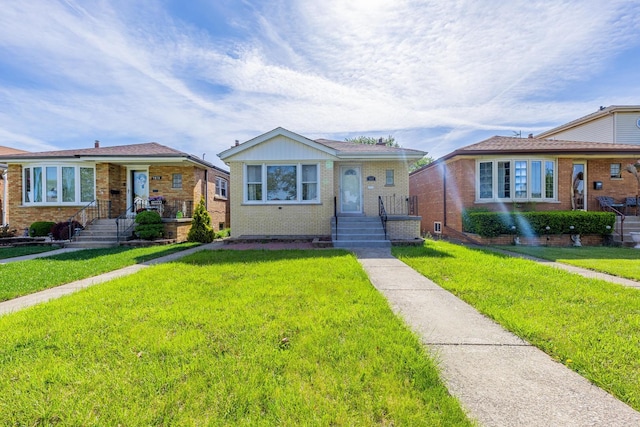 7817 Menard Ave, Burbank, IL 60459 - bungalow-style home with brick siding and a front lawn