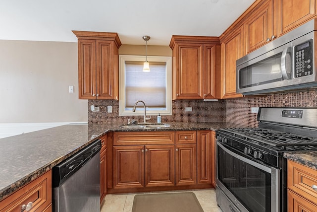 7817 Menard Ave, Burbank, IL 60459 - kitchen featuring appliances with stainless steel finishes, a sink, brown cabinets, and decorative backsplash