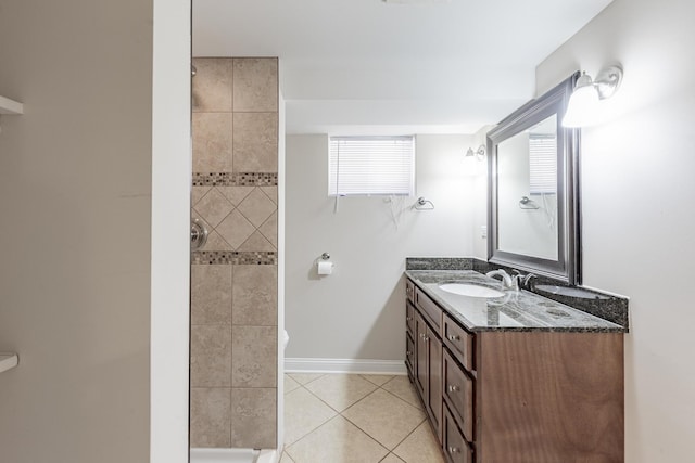 7817 Menard Ave, Burbank, IL 60459 - full bath with vanity, tile patterned flooring, tiled shower, and baseboards