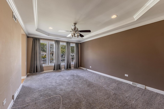 7817 Menard Ave, Burbank, IL 60459 - carpeted empty room with a ceiling fan, crown molding, a tray ceiling, baseboards, and recessed lighting