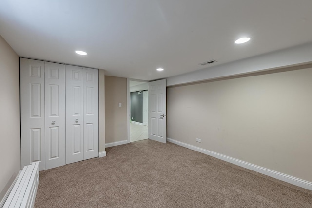 7817 Menard Ave, Burbank, IL 60459 - unfurnished bedroom featuring carpet floors, recessed lighting, a baseboard radiator, baseboards, and a closet