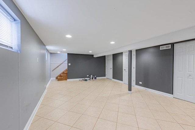 7817 Menard Ave, Burbank, IL 60459 - below grade area featuring stairway, recessed lighting, baseboards, and light tile patterned flooring