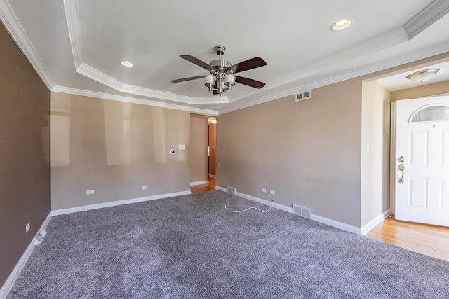 7817 Menard Ave, Burbank, IL 60459 - spare room with a raised ceiling, carpet, ceiling fan, crown molding, and recessed lighting