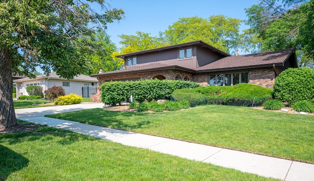 14207 Concord Dr, Orland Park, IL 60462 - view of front of house with brick siding and a front yard