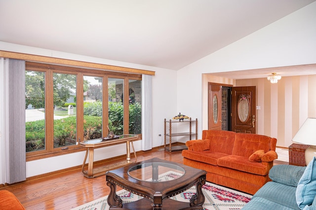 14207 Concord Dr, Orland Park, IL 60462 - living area featuring vaulted ceiling, light wood-type flooring, and baseboards