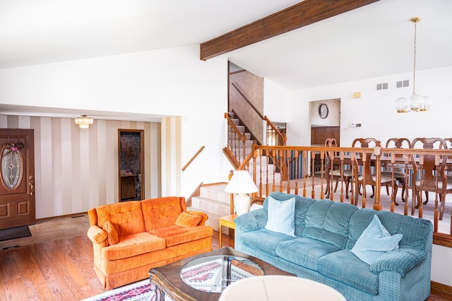 14207 Concord Dr, Orland Park, IL 60462 - living room featuring stairs, wood finished floors, and a chandelier