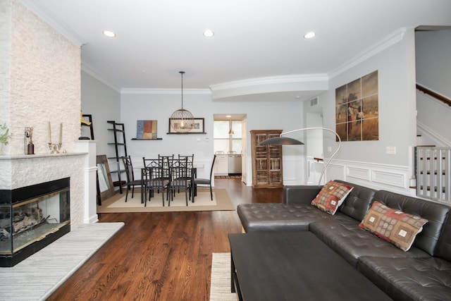 235 S Marion St Unit C, Oak Park, IL 60302 - living area featuring wood finished floors, ornamental molding, stairway, recessed lighting, and a stone fireplace