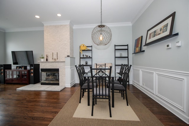 235 S Marion St Unit C, Oak Park, IL 60302 - dining area featuring crown molding, wood finished floors, a multi sided fireplace, recessed lighting, and a wainscoted wall