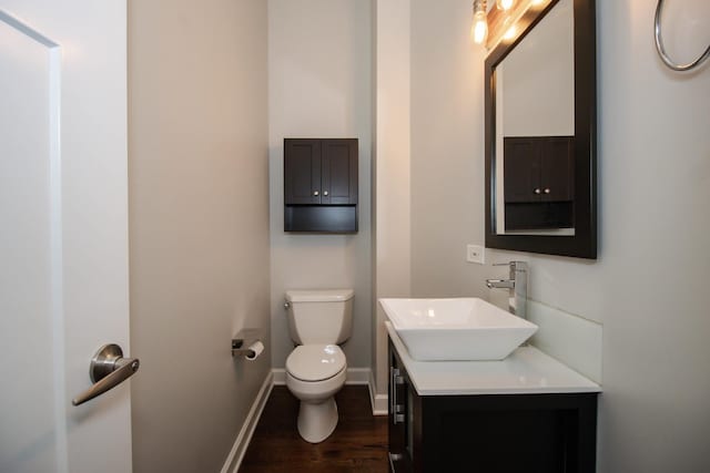 235 S Marion St Unit C, Oak Park, IL 60302 - half bath featuring toilet, wood finished floors, baseboards, and vanity