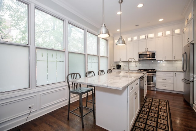 235 S Marion St Unit C, Oak Park, IL 60302 - kitchen with stainless steel appliances, a sink, crown molding, white cabinets, and tasteful backsplash